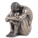 Figurine en resine Homme assis avec tete sur ge